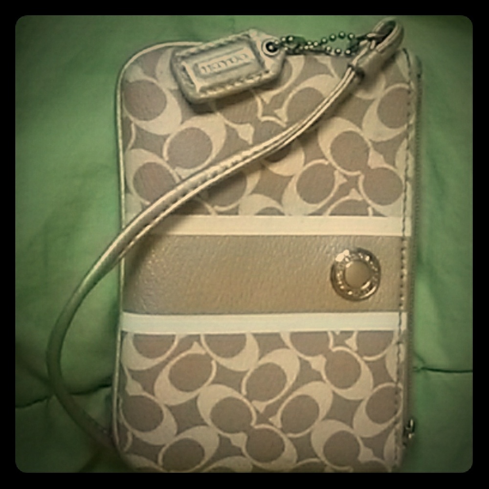 Small tan and white authentic Coach wristlet